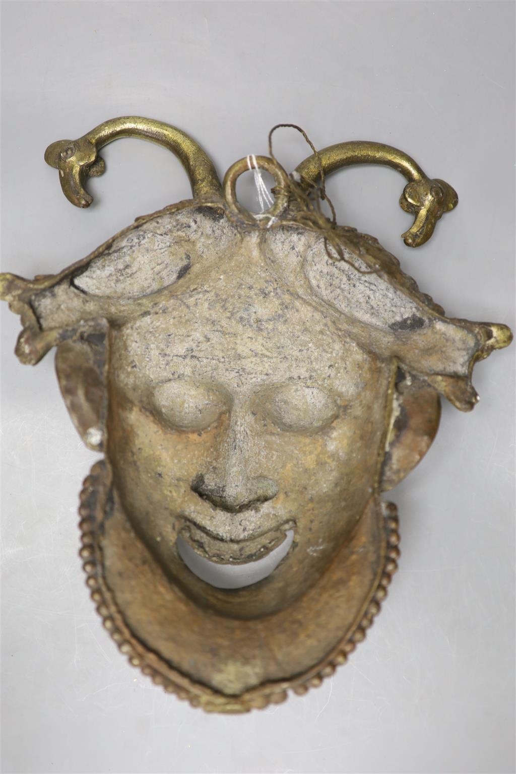 A gilt bronze wall mask, height 33cm